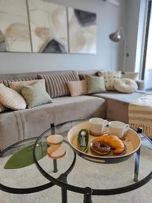 a coffee table with a tray of food on it in a living room at Relax in Belgrade