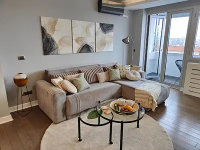 a living room with a couch and a table at Relax in Belgrade