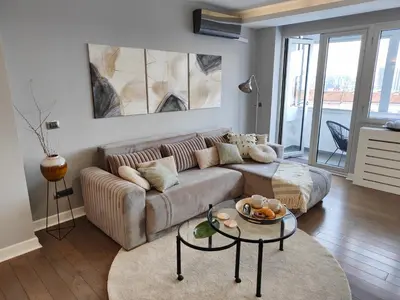 a living room with a couch and a table at Relax in Belgrade