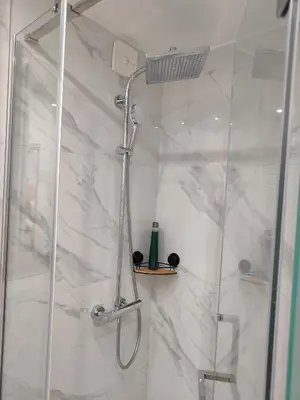 a shower with a glass door in a bathroom at Elixir in Belgrade