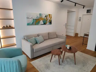 a living room with a couch and a table at Elixir in Belgrade