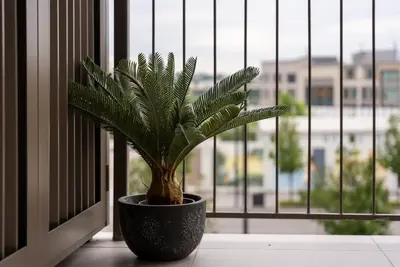 a plant in a pot sitting on a window sill at ZIGZAG Belgrade Waterfront Aqua in Belgrade
