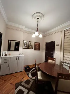 a living room with a dining room table and a dining room at Apartman Sasha 1 - Ask for free parking in Sajmište