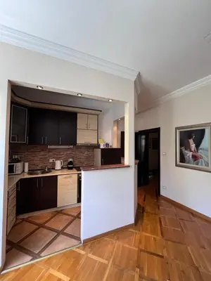 an empty kitchen with a counter in a room at Apartman Sasha 1 - Ask for free parking in Sajmište