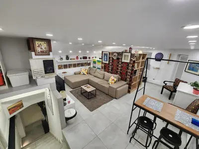 a living room with a couch and a table at Professor's Krunska Studio in Belgrade