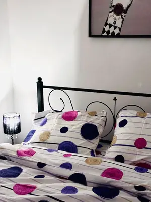 a bedroom with a bed with pillows on it at HUGO OLD TOWN in Belgrade