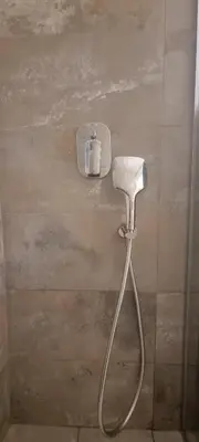 a shower head on the wall of a bathroom at HUGO OLD TOWN in Belgrade