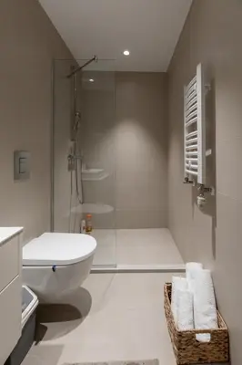 a bathroom with a shower and a toilet and a sink at inJoy in Belgrade