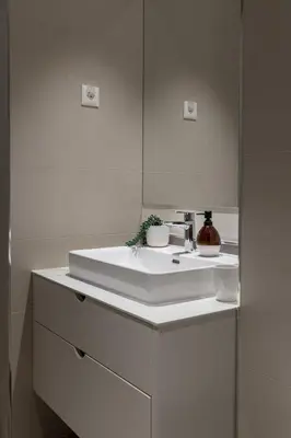 a white bathroom with a sink and a mirror at inJoy in Belgrade