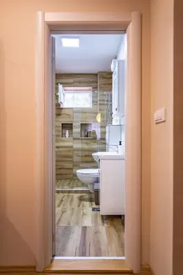 a bathroom with a toilet and a sink at Charna apartment Beograd Železnik in Železnik