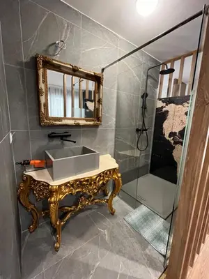 a bathroom with a sink and a mirror at Parliament Studio Appartment in Belgrade