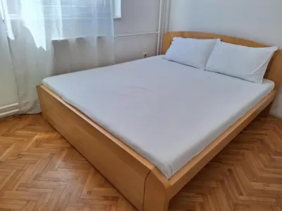 a bed in a room with a white mattress at RIVIJERA LAKES Ada Studio in Belgrade