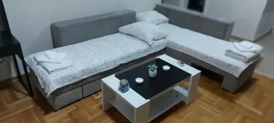 a model of a living room with a couch and a table at RubiCon Apartments in Belgrade