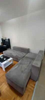 a living room with two beds and a coffee table at RubiCon Apartments in Belgrade