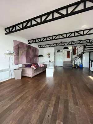 a large living room with a couch in the middle at Floating Zen House in Belgrade