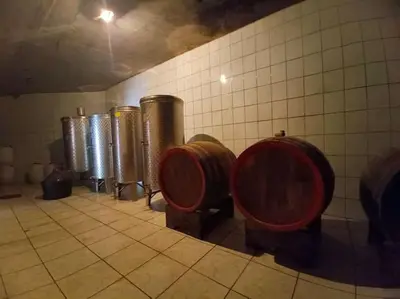 a bathroom with a row of barrels and toilets at Apartman u potkrovlju in Sremski Karlovci