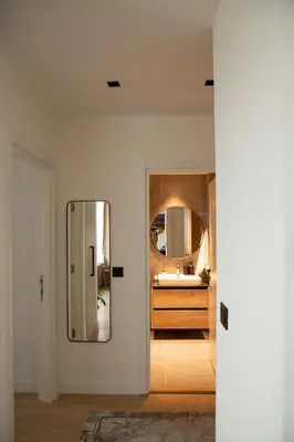 a bathroom with a mirror and a sink at Belgrade Waterfront Sunshine apartment in Belgrade