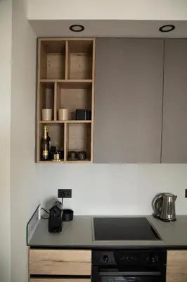 a kitchen with a stove and a counter top at Belgrade Waterfront Sunshine apartment in Belgrade