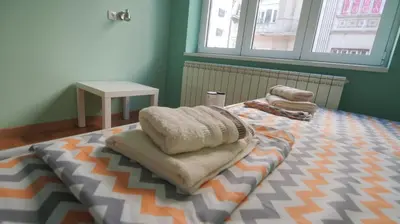 a bedroom with a bed with towels on it at Stella Di Notte VIP in Belgrade