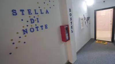 a room with a wall with stars on the wall at Stella Di Notte VIP in Belgrade