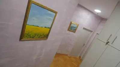 a bathroom with a window with a view of a yellow field at Stella Di Notte VIP in Belgrade