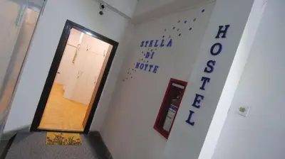 a hallway with a door in a room with a staircase at Stella Di Notte VIP in Belgrade