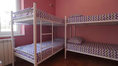 two bunk beds in a room with a window at Stella Di Notte VIP in Belgrade