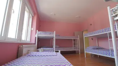a room with three bunk beds and a window at Stella Di Notte VIP in Belgrade