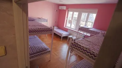 a room with four bunk beds and a window at Stella Di Notte VIP in Belgrade