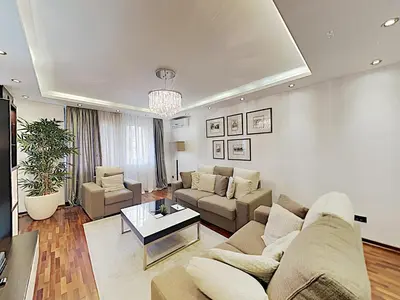 a living room with a couch and a table at ETNOGRAF in Belgrade