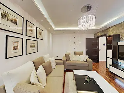 a living room with a couch and a tv at ETNOGRAF in Belgrade