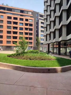 a circle of grass in front of some buildings at Kalemegdan Park Residence - new luxury apartment in Belgrade