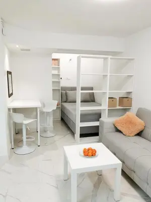 a living room with a couch and a table at Tesla in Belgrade