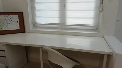 a white desk in a room with a window at Tesla in Belgrade