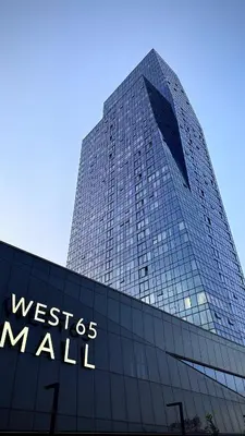 a tall building with the words west des mall on it at West 21 Tower in Fontana