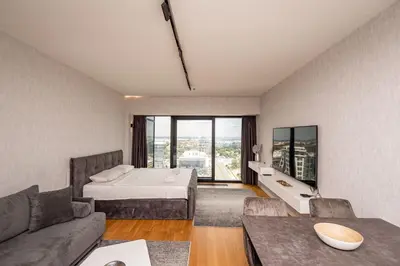 a hotel room with a bed and a couch at West Tower Luxury in Fontana