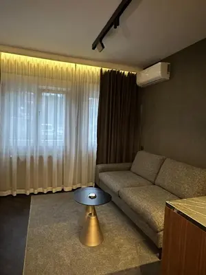a living room with a couch and a table at Sima City Center in Belgrade