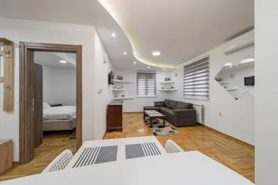 a living room with a bed and a couch at Port 1 in Belgrade