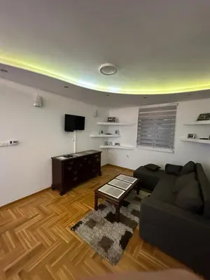 a living room with a couch and a table at Port 1 in Belgrade