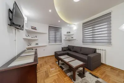 a living room with a couch and a tv at Port 1 in Belgrade