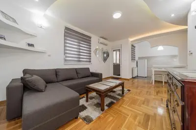 a living room with a couch and a table at Port 1 in Belgrade