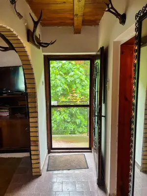 a hallway with a large window in a house at Varljivo leto, Fruska gora in Čortanovci