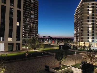 a view of two tall buildings at night at Apartman Julija in Sajmište