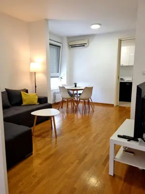 a living room with a couch and a table at Euforia apartment in Novi Beograd