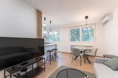 a living room with a couch and a table at Angelo S in Belgrade