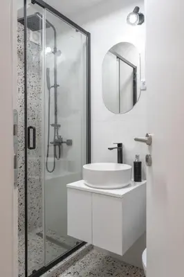 a white bathroom with a sink and a shower at Angelo S in Belgrade