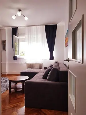 a living room with a couch and a table at Emili apartment in Belgrade