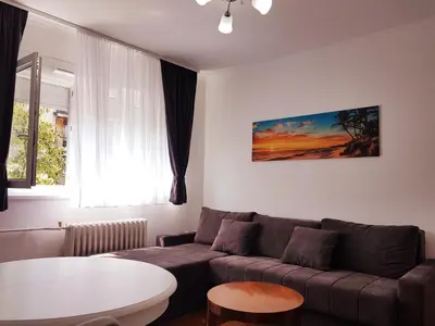 a living room with a couch and a table at Emili apartment in Belgrade