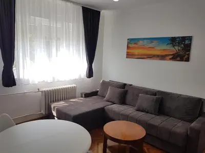 a living room with a couch and a table at Emili apartment in Belgrade