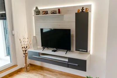 a living room with a flat screen tv on a wall at Rajski Kutak in Arandjelovac